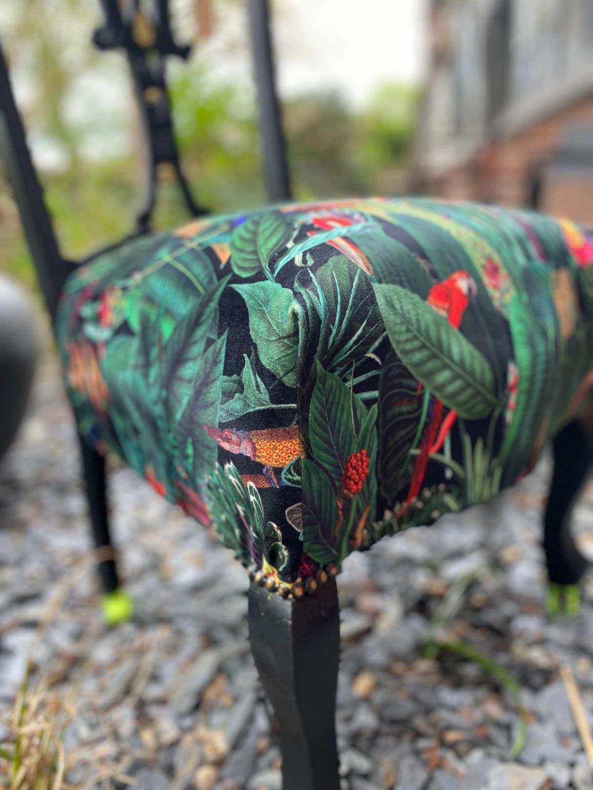 Victorian nursing chair reupholstered in Amazon jungle printed velvet and detailed with 18ct gold leaf