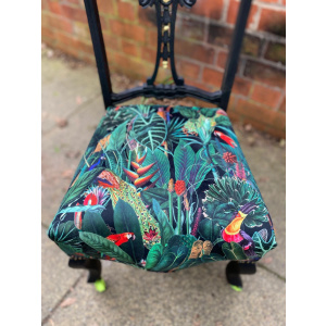 Victorian nursing chair reupholstered in Amazon jungle printed velvet and detailed with 18ct gold leaf