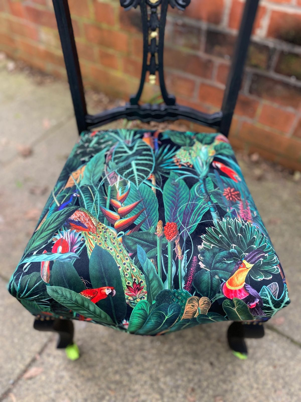 Victorian nursing chair reupholstered in Amazon jungle printed velvet and detailed with 18ct gold leaf