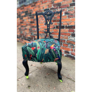 Victorian nursing chair reupholstered in Amazon jungle printed velvet and detailed with 18ct gold leaf