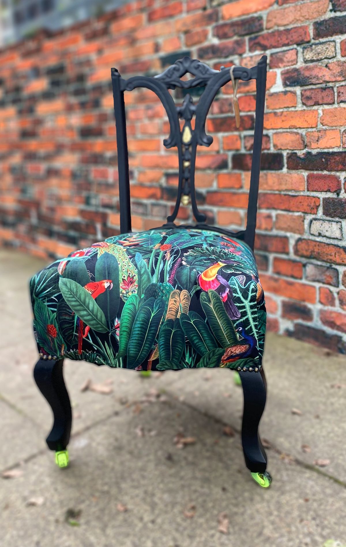 Victorian nursing chair reupholstered in Amazon jungle printed velvet and detailed with 18ct gold leaf