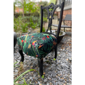 Victorian nursing chair reupholstered in Amazon jungle printed velvet and detailed with 18ct gold leaf