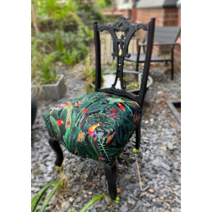 Victorian nursing chair reupholstered in Amazon jungle printed velvet and detailed with 18ct gold leaf