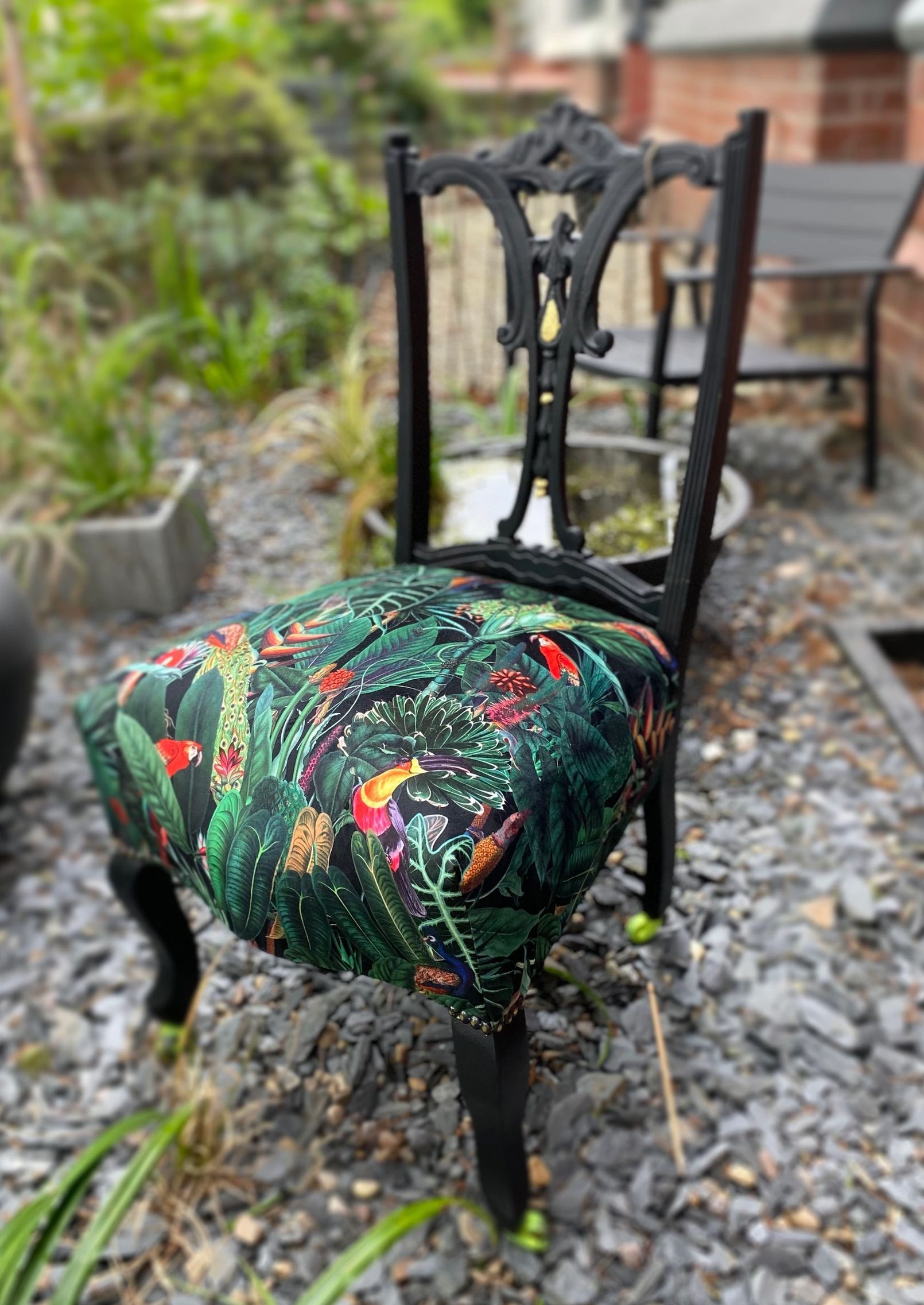 Victorian nursing chair reupholstered in Amazon jungle printed velvet and detailed with 18ct gold leaf