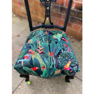 Victorian nursing chair reupholstered in Amazon jungle printed velvet and detailed with 18ct gold leaf