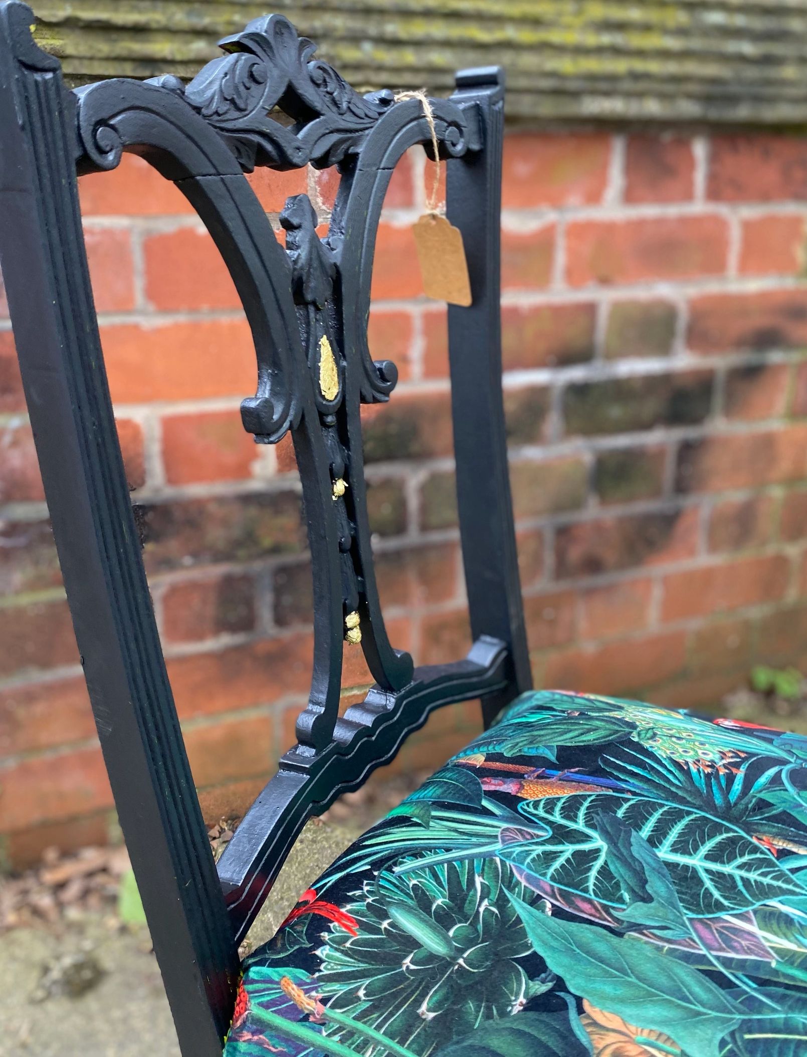 Victorian nursing chair reupholstered in Amazon jungle printed velvet and detailed with 18ct gold leaf