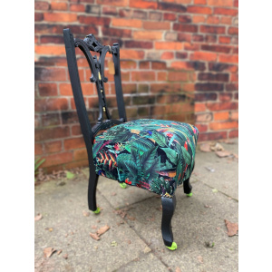 Victorian nursing chair reupholstered in Amazon jungle printed velvet and detailed with 18ct gold leaf