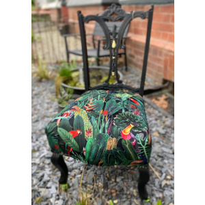 Victorian nursing chair reupholstered in Amazon jungle printed velvet and detailed with 18ct gold leaf