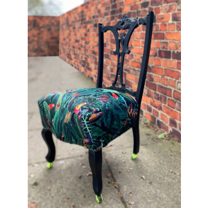 Victorian nursing chair reupholstered in Amazon jungle printed velvet and detailed with 18ct gold leaf