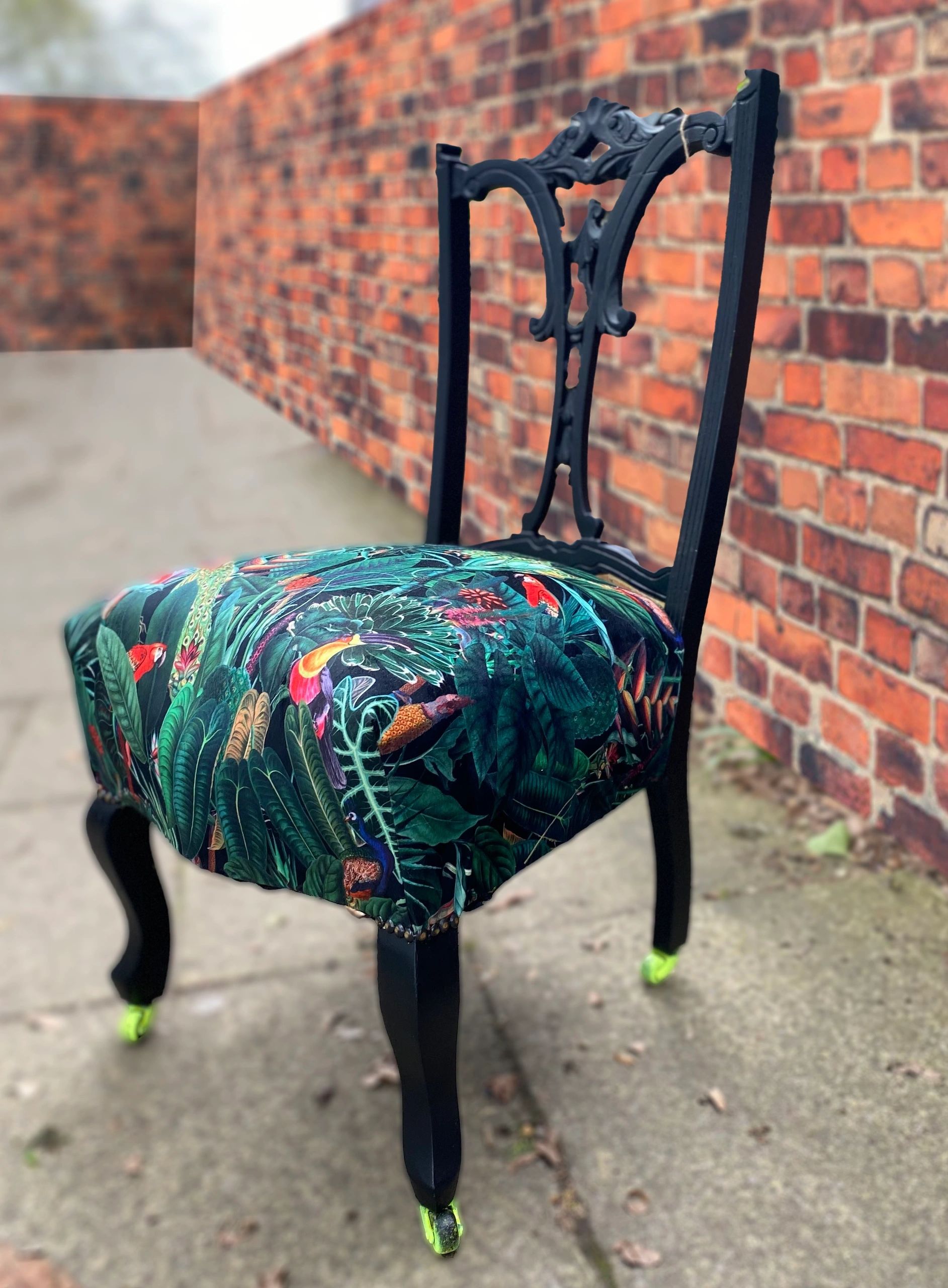 Victorian nursing chair reupholstered in Amazon jungle printed velvet and detailed with 18ct gold leaf