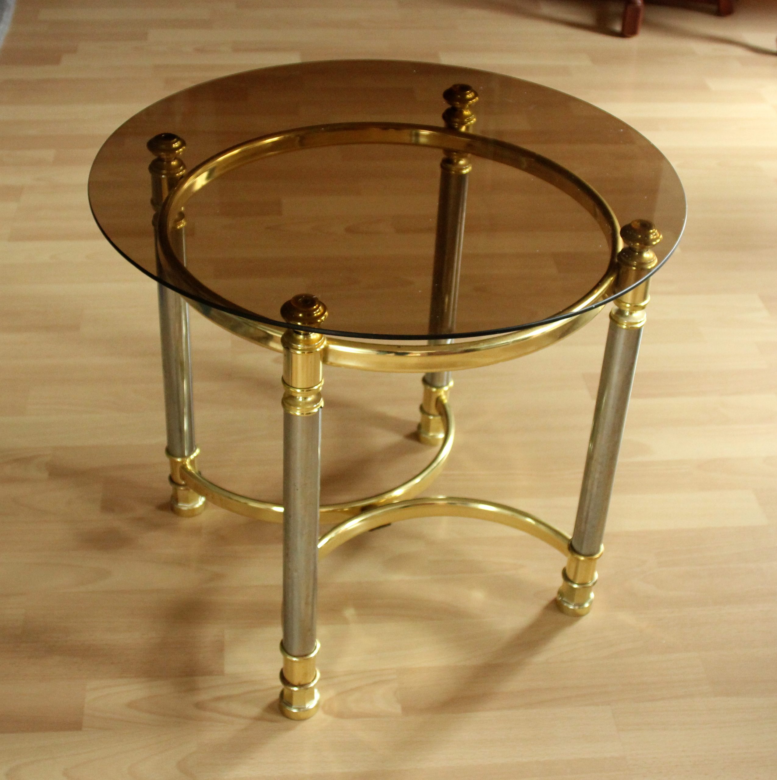 Hollywood Regency Style round coffee table, side table, made of metal with a smoked glass plate, vintage from the 1970s