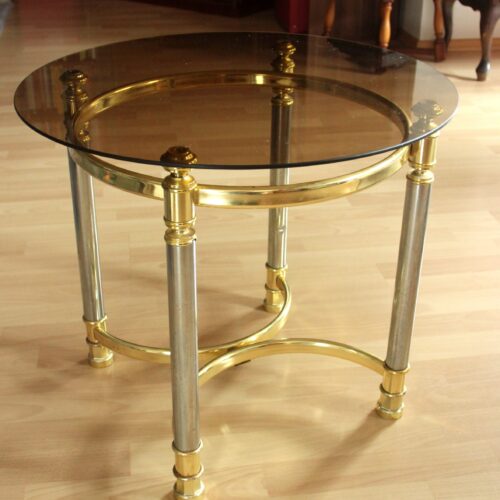 Hollywood Regency Style round coffee table, side table, made of metal with a smoked glass plate, vintage from the 1970s