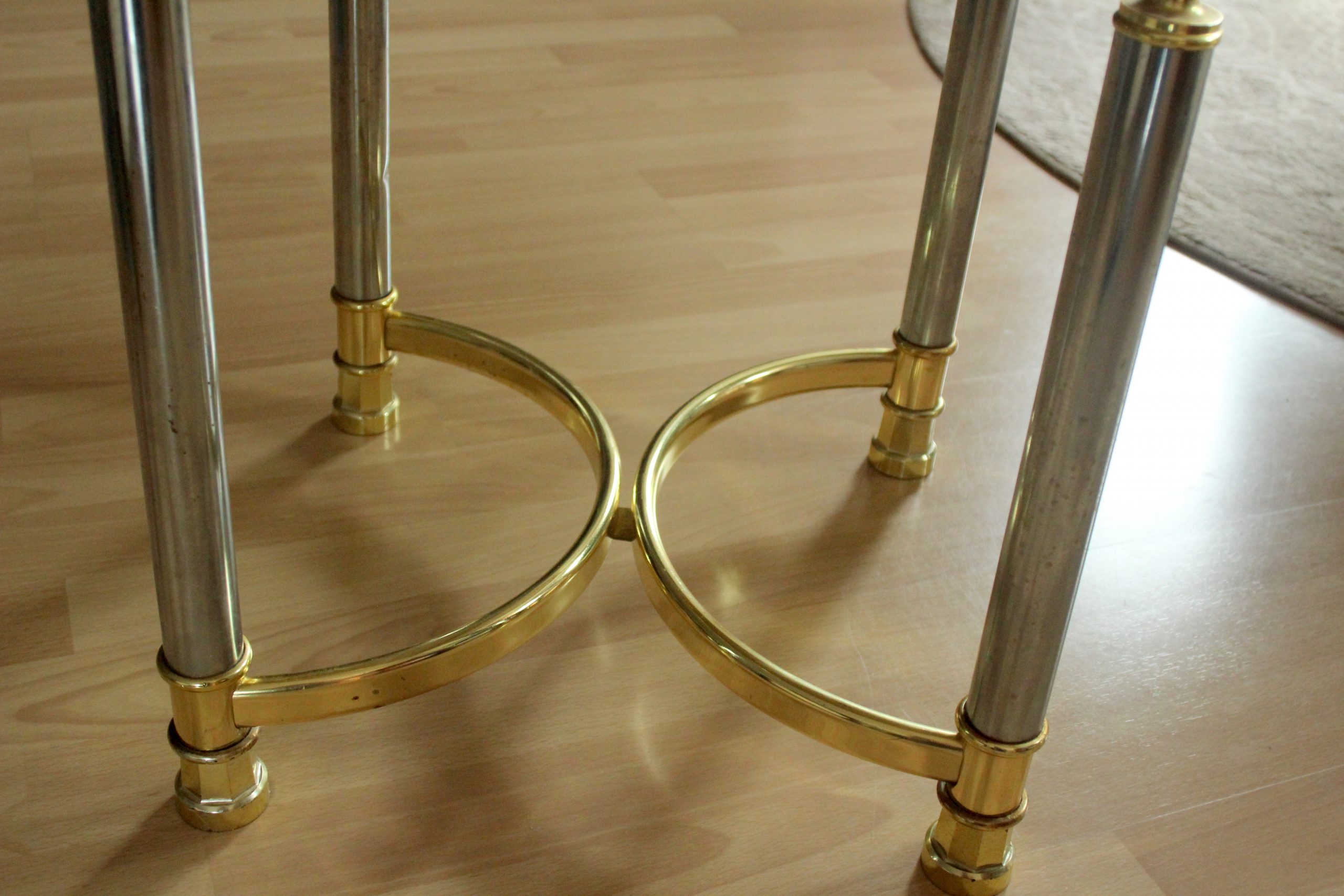 Hollywood Regency Style round coffee table, side table, made of metal with a smoked glass plate, vintage from the 1970s