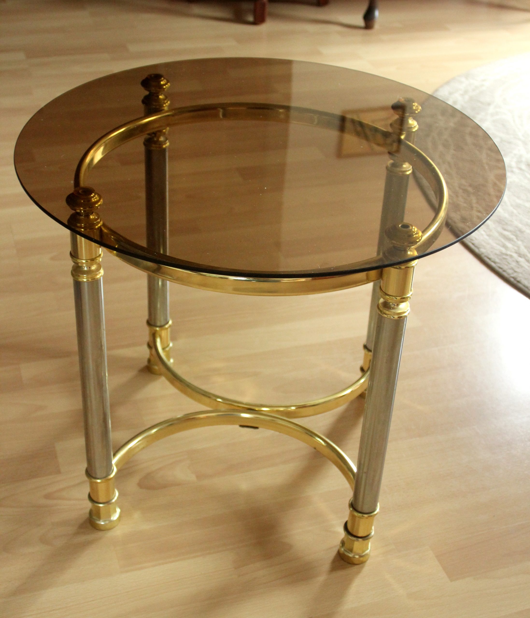 Hollywood Regency Style round coffee table, side table, made of metal with a smoked glass plate, vintage from the 1970s