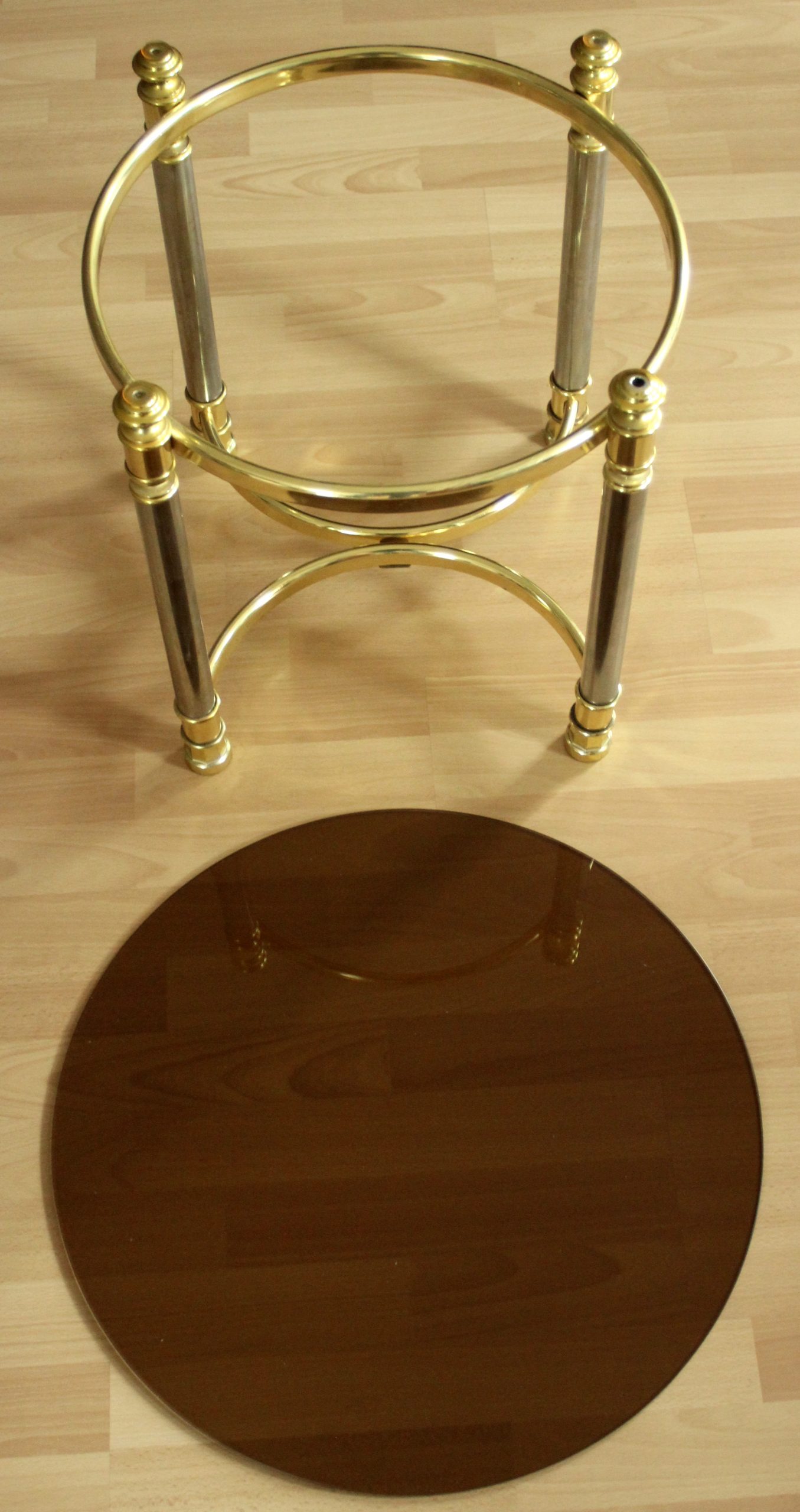 Hollywood Regency Style round coffee table, side table, made of metal with a smoked glass plate, vintage from the 1970s