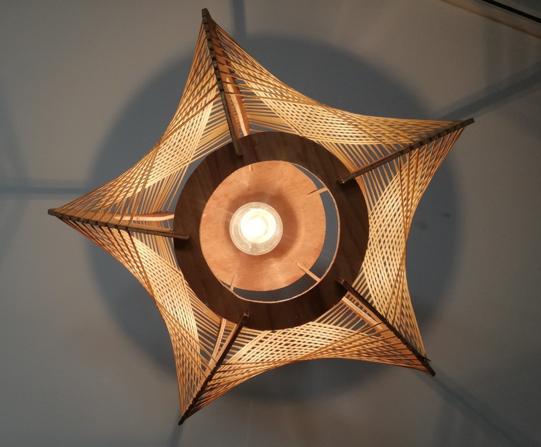 Brown plywood and straw spiderweb mid century rustic hanging lamp 1960s