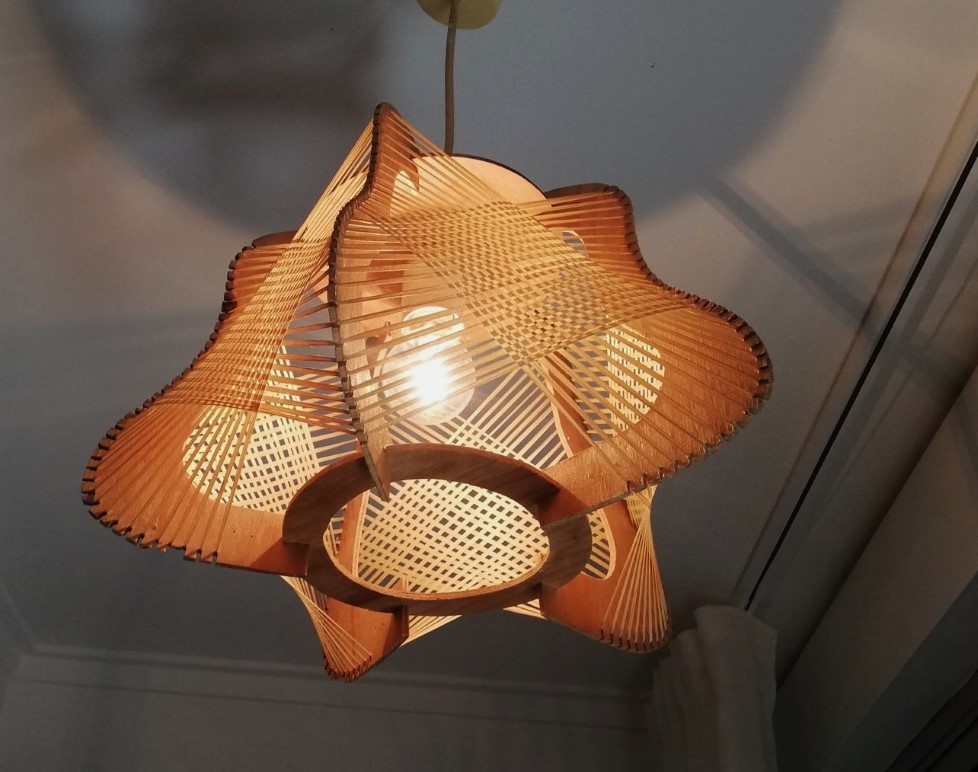 Brown plywood and straw spiderweb mid century rustic hanging lamp 1960s