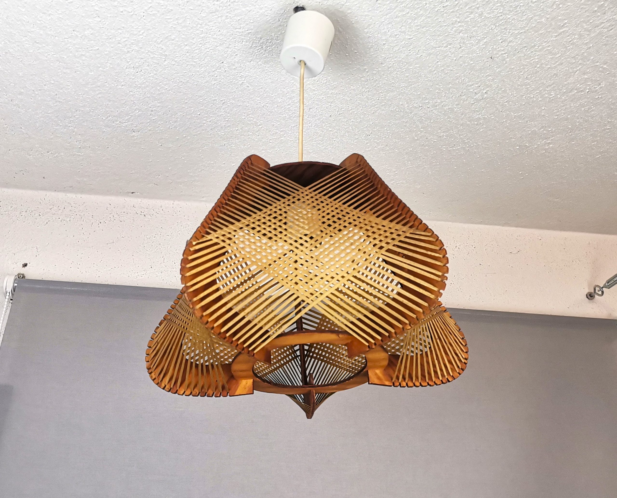 Brown plywood and straw spiderweb mid century rustic hanging lamp 1960s
