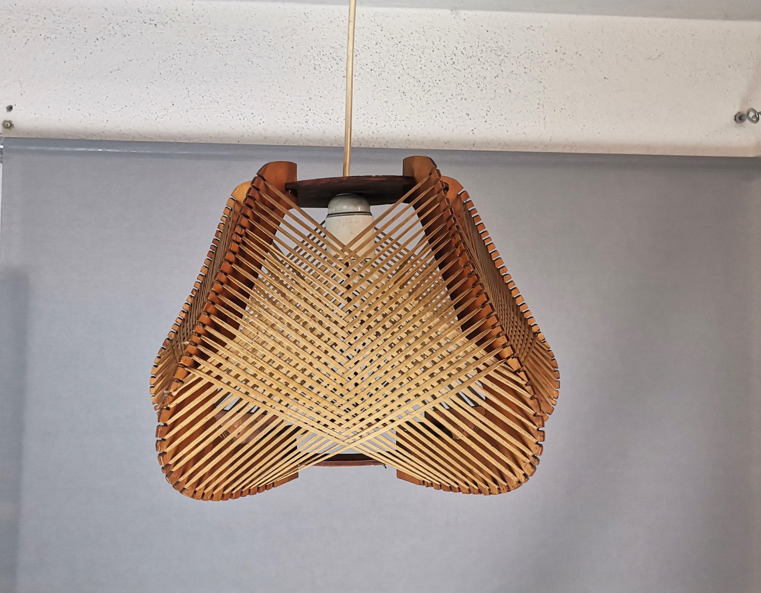 Brown plywood and straw spiderweb mid century rustic hanging lamp 1960s