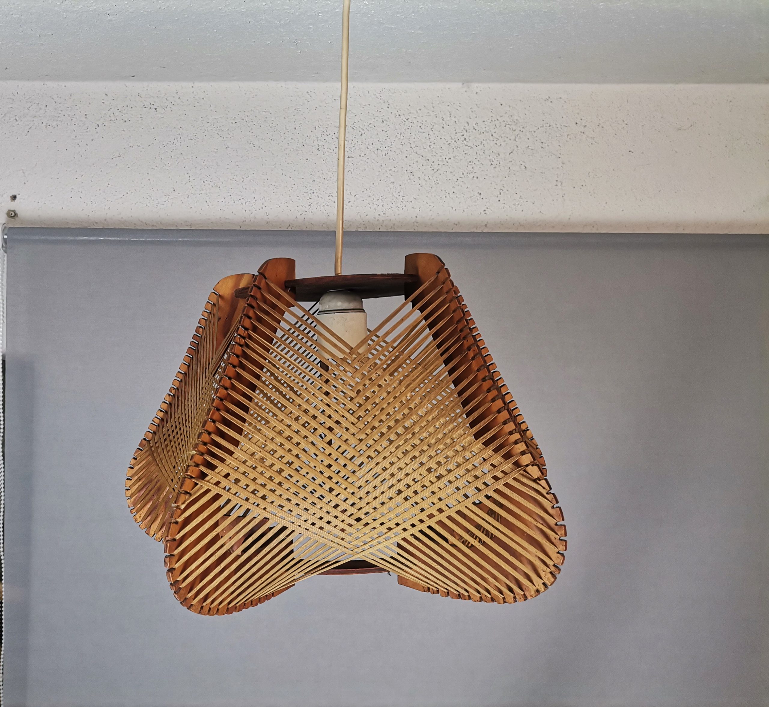 Brown plywood and straw spiderweb mid century rustic hanging lamp 1960s