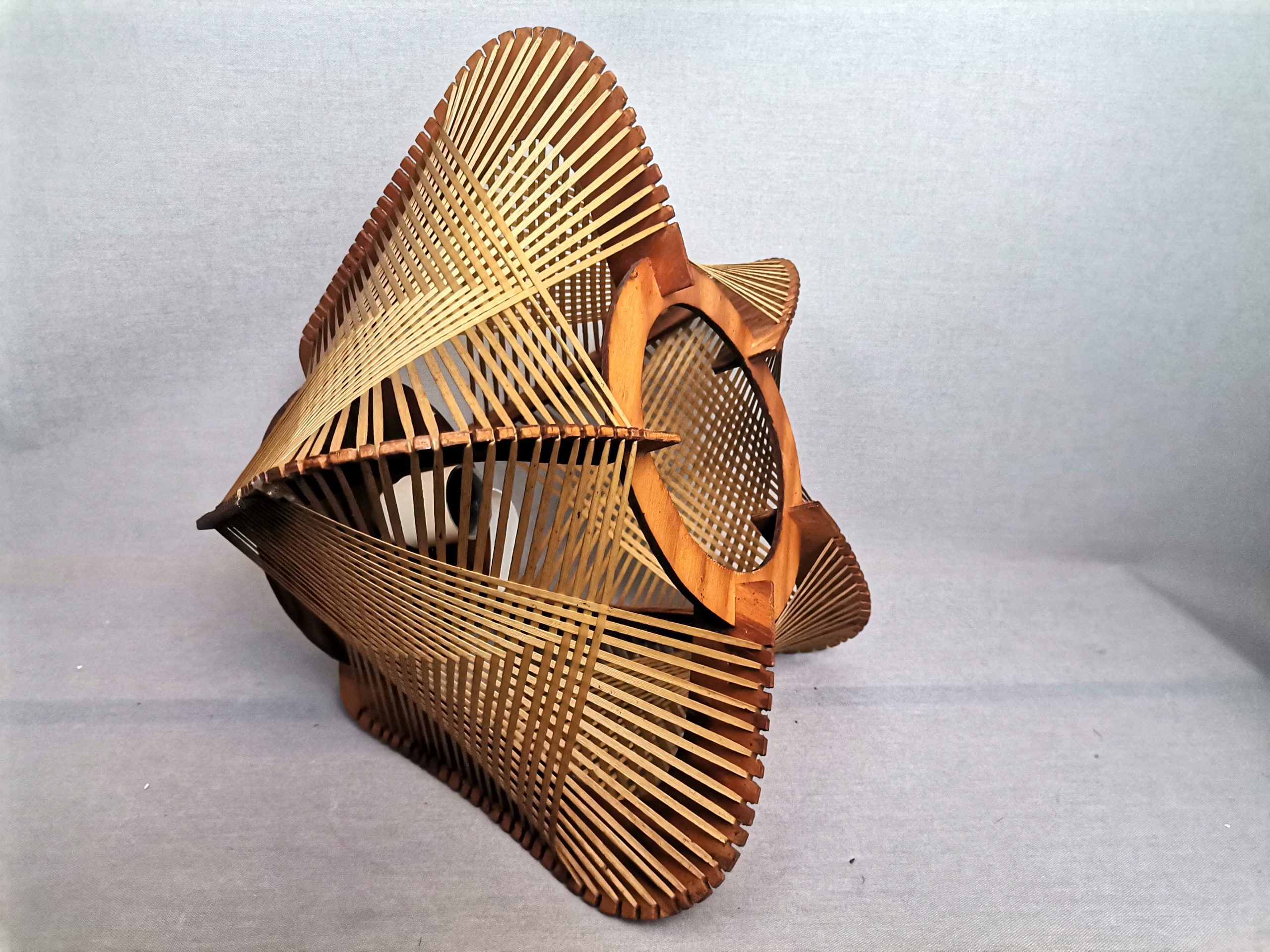 Brown plywood and straw spiderweb mid century rustic hanging lamp 1960s