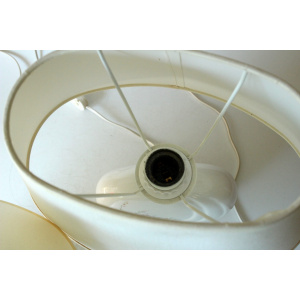 2 Bedside lamps made of white ceramic with floral motifs and with fabric lampshades, vintage from the 1970s