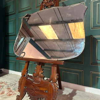 Large vintage shield shaped wall mirror having a bevelled edge