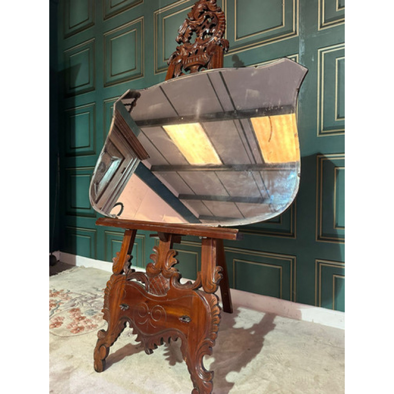 Large vintage shield shaped wall mirror having a bevelled edge