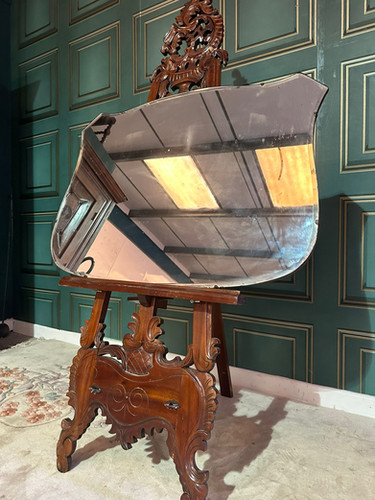 Large vintage shield shaped wall mirror having a bevelled edge