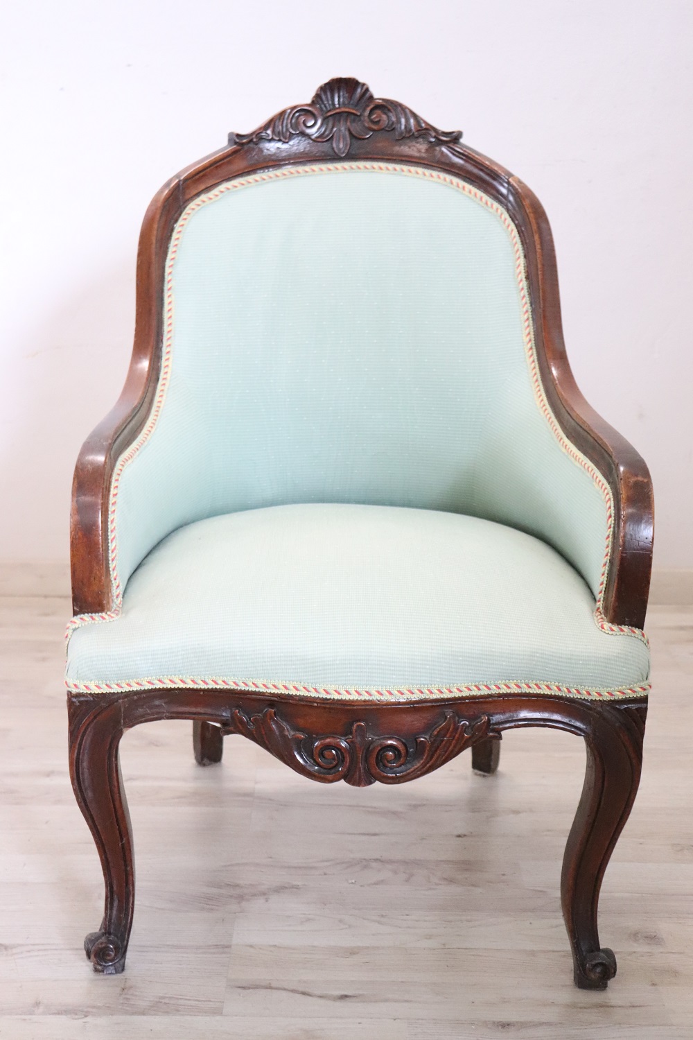 Antique upholstered walnut armchair