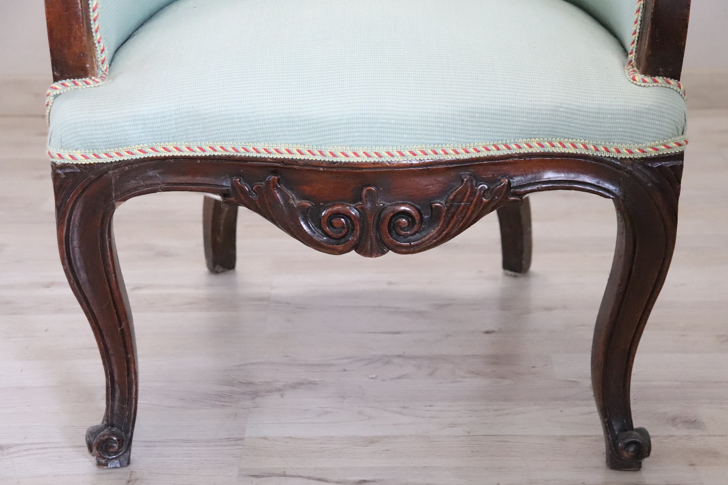 Antique upholstered walnut armchair