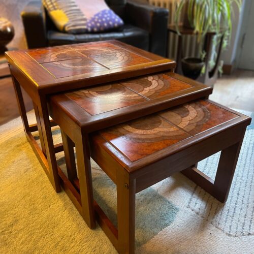 Mid century trio nesting tables with intact tile tops with teak frames and styled legs