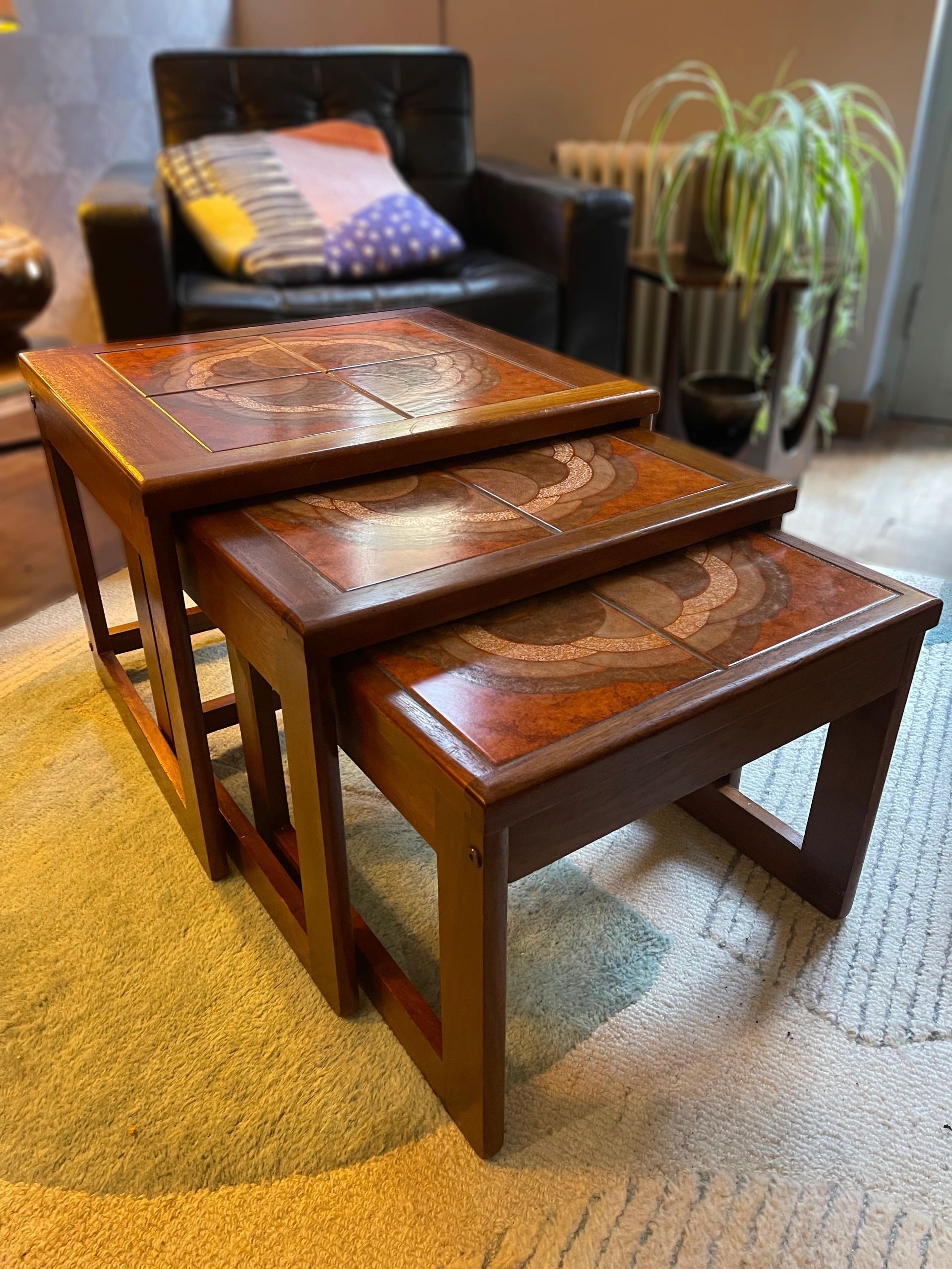 Mid century trio nesting tables with intact tile tops with teak frames and styled legs