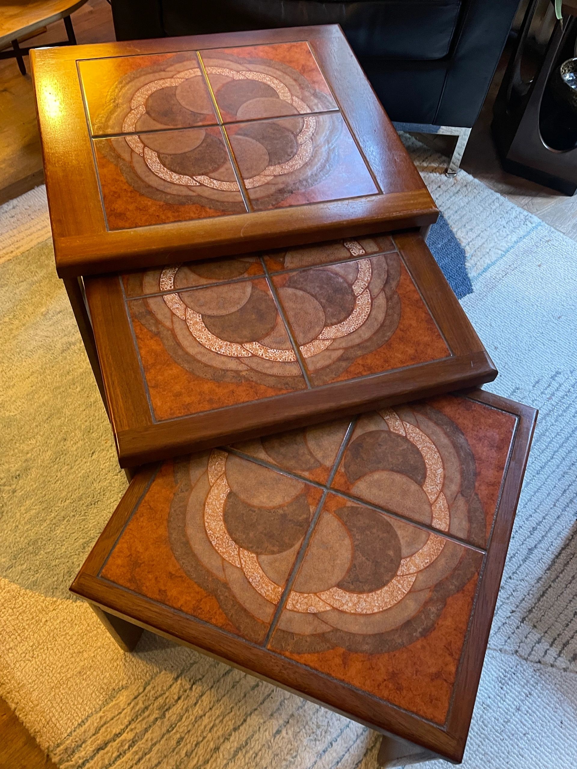 Mid century trio nesting tables with intact tile tops with teak frames and styled legs