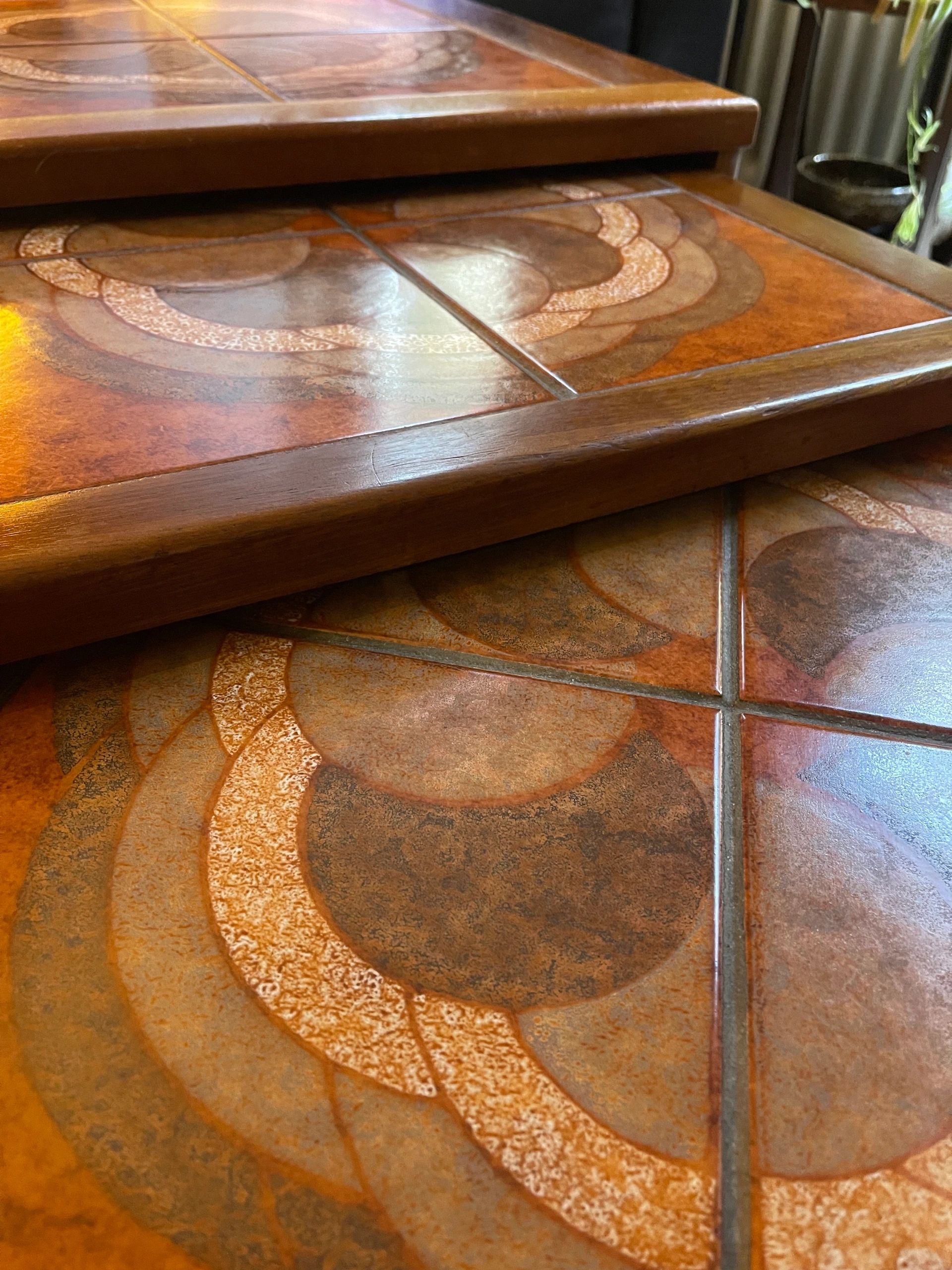 Mid century trio nesting tables with intact tile tops with teak frames and styled legs