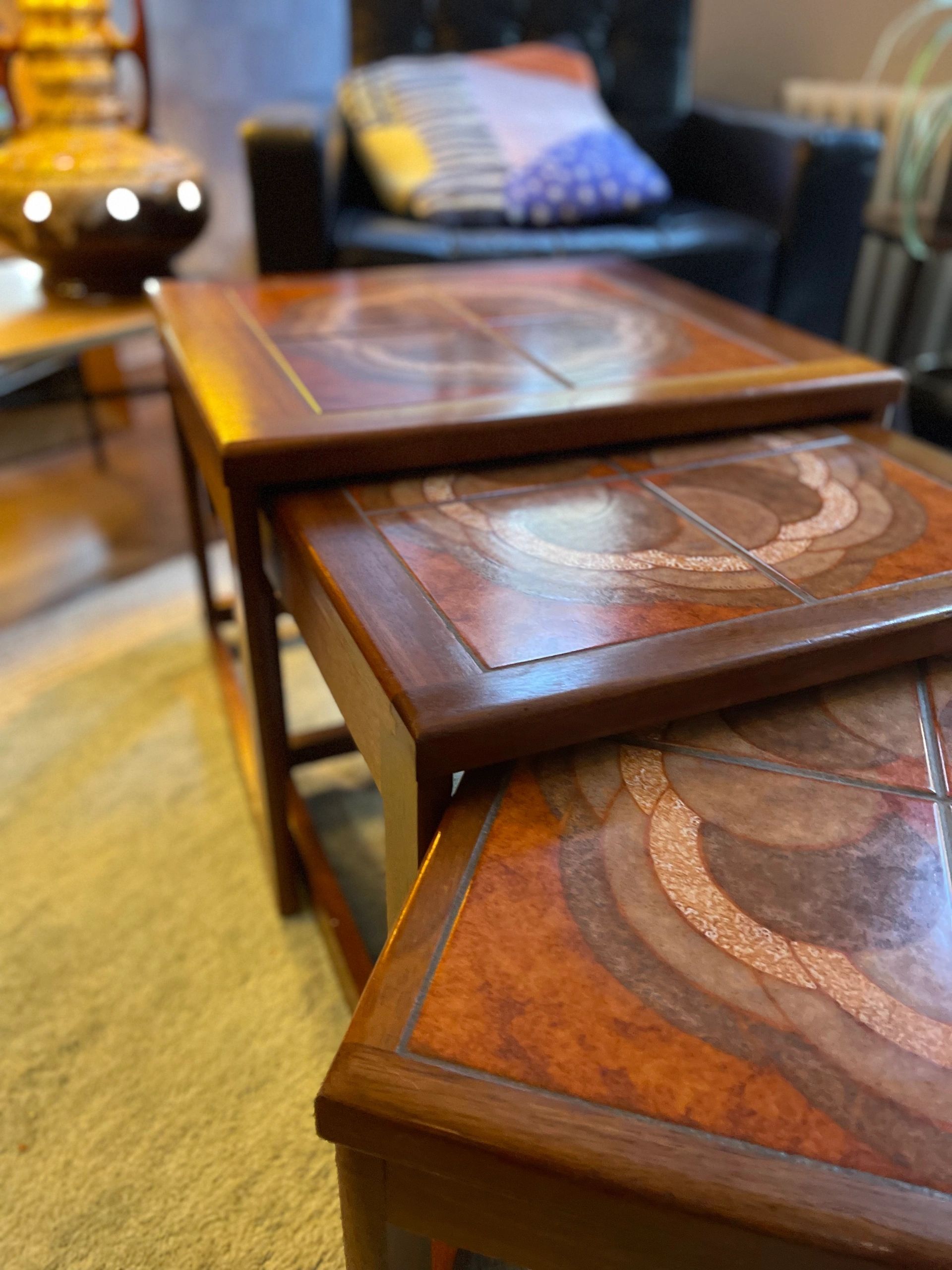 Mid century trio nesting tables with intact tile tops with teak frames and styled legs