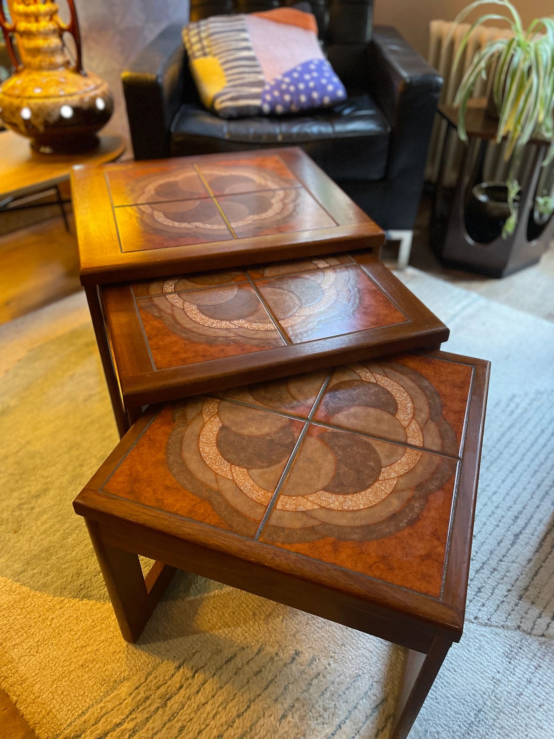 Mid century trio nesting tables with intact tile tops with teak frames and styled legs