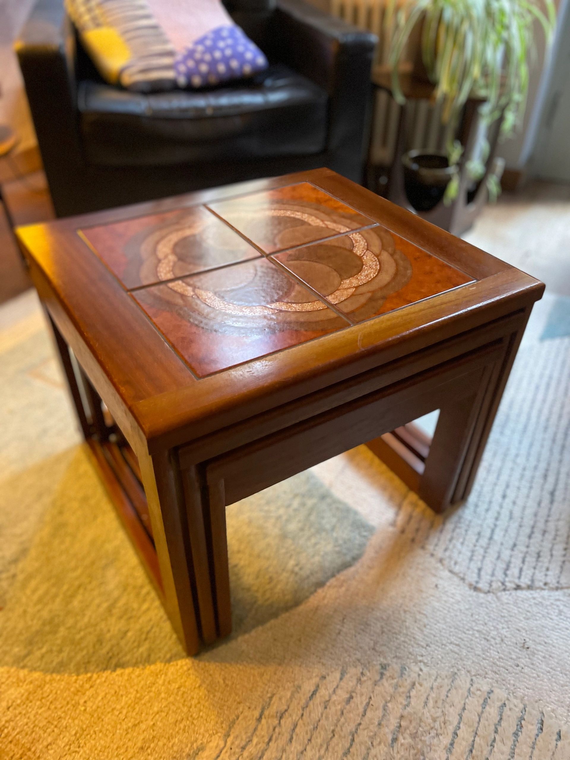Mid century trio nesting tables with intact tile tops with teak frames and styled legs