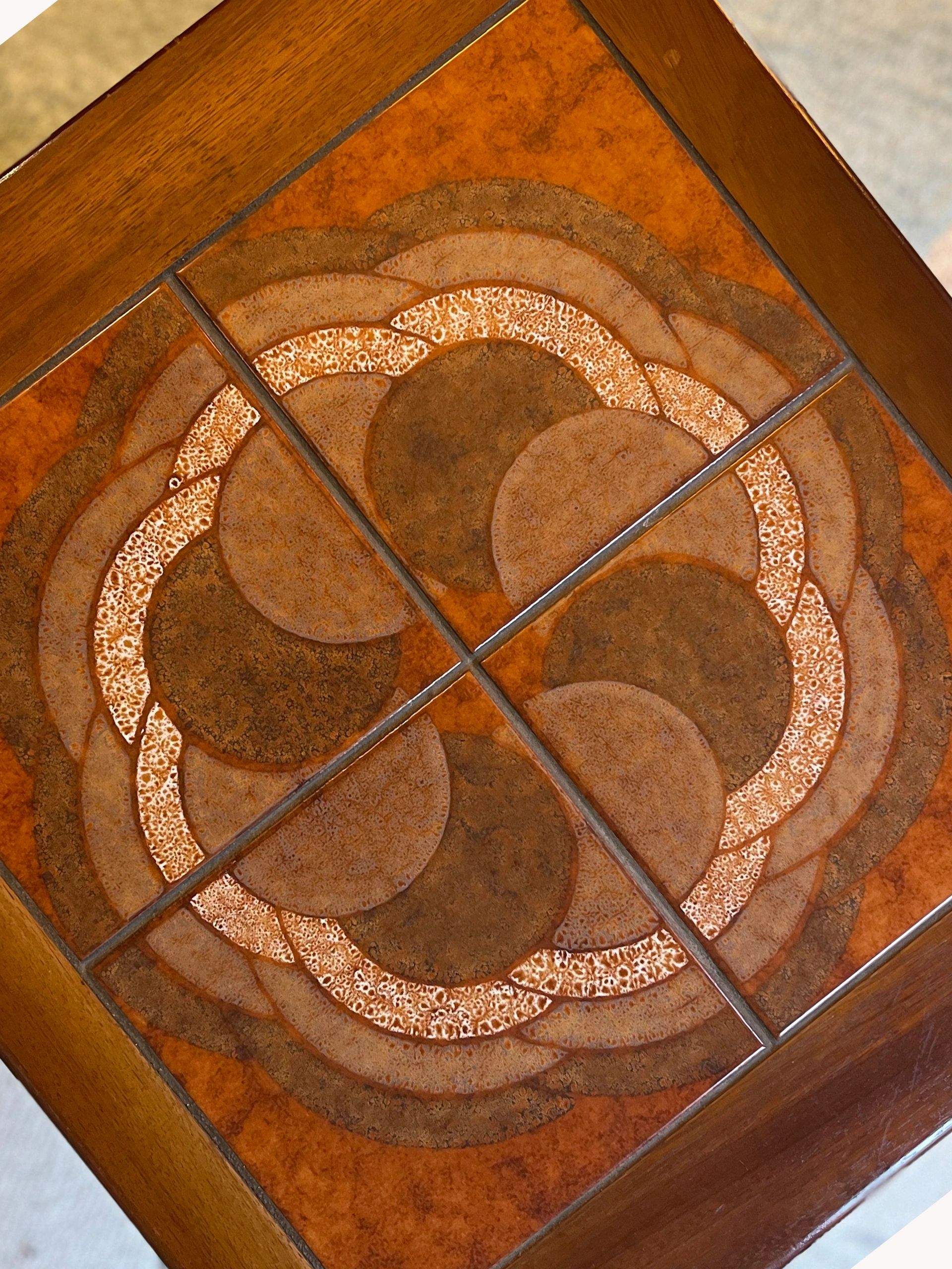 Mid century trio nesting tables with intact tile tops with teak frames and styled legs