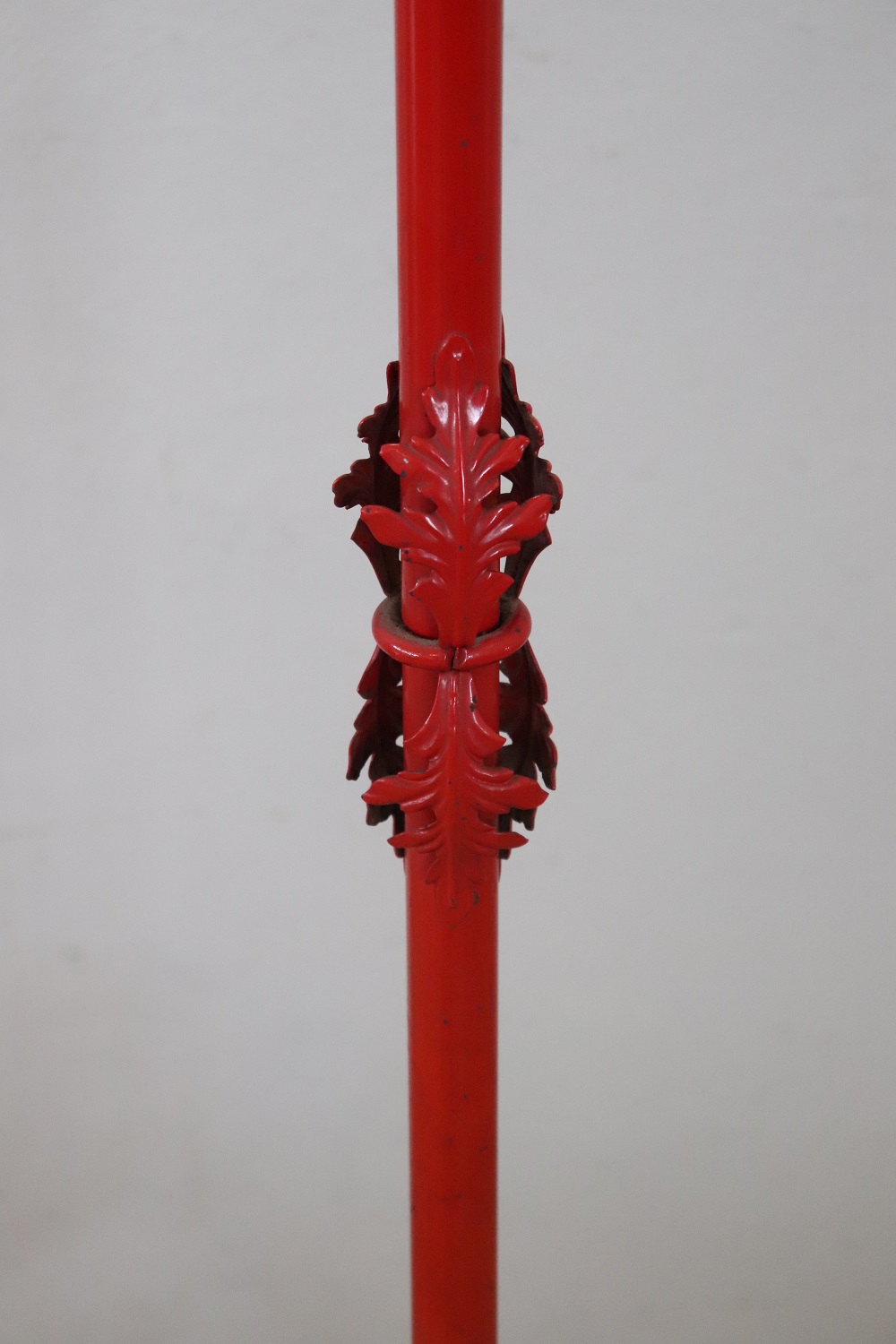 Coat hanger in red lacquered iron