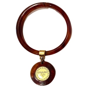 1990s Prada Resin Brown Bangle with Hanging Gold Metal Medallion