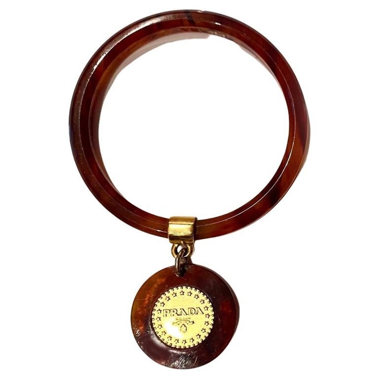 1990s Prada Resin Brown Bangle with Hanging Gold Metal Medallion