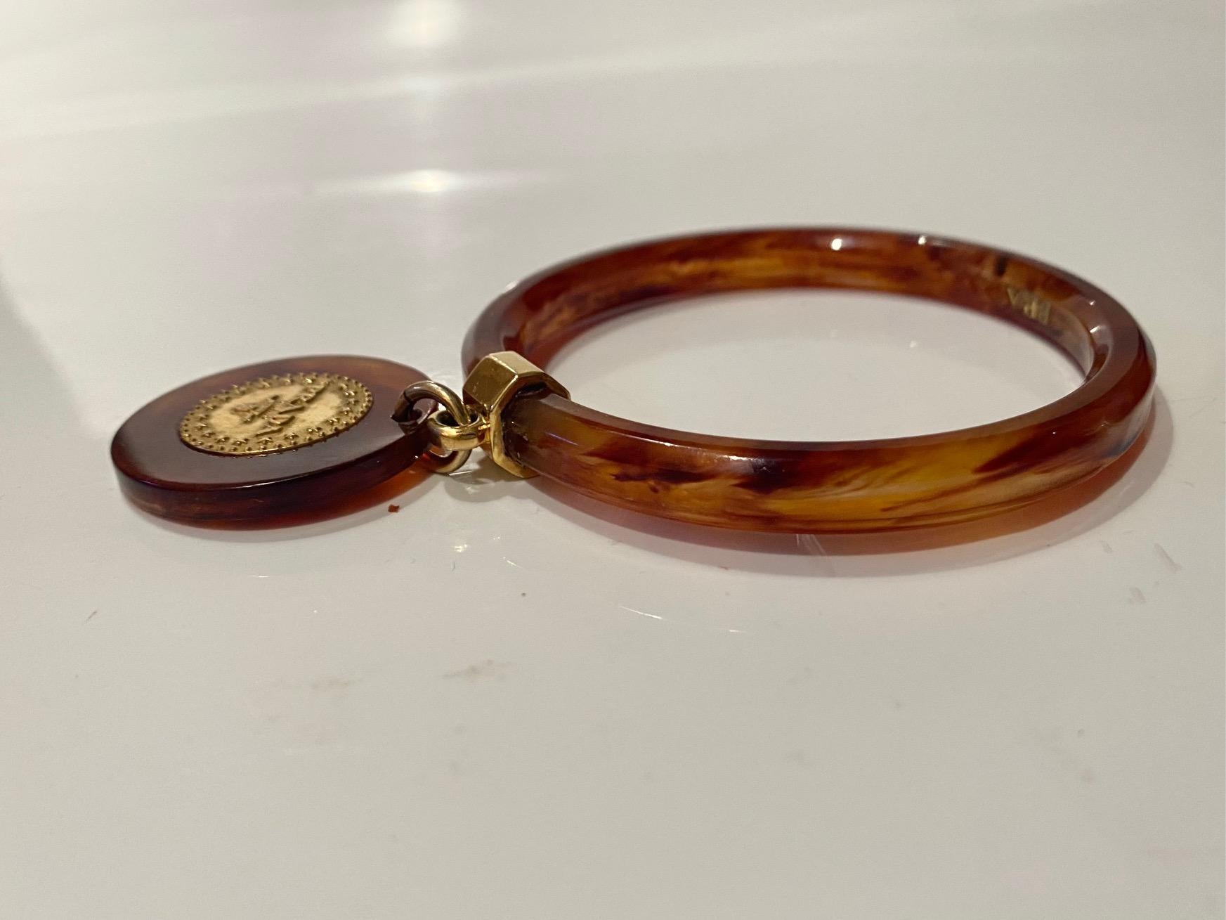 1990s Prada Resin Brown Bangle with Hanging Gold Metal Medallion