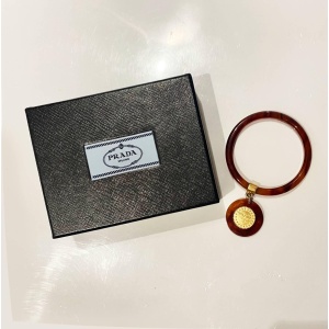 1990s Prada Resin Brown Bangle with Hanging Gold Metal Medallion