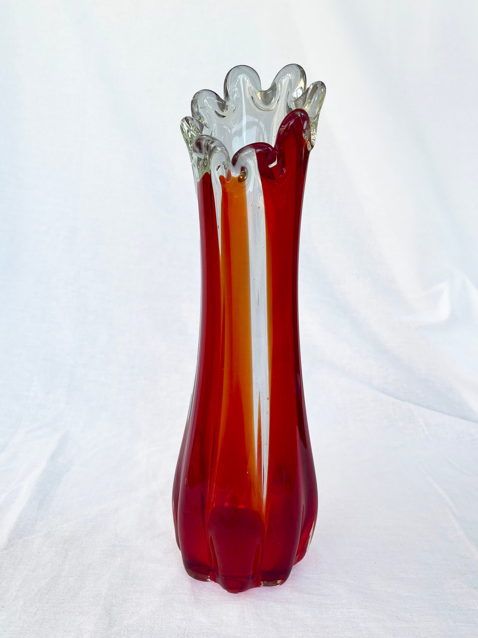 Mid century Vintage large swung glass vase in vibrant retro orange and hot red tones circa 1970's