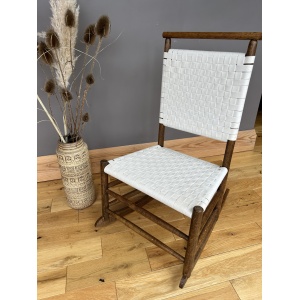Arts and Crafts Shaker style oak rocking chair with a woven white cotton seat