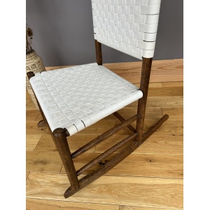 Arts and Crafts Shaker style oak rocking chair with a woven white cotton seat