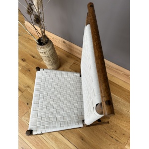 Arts and Crafts Shaker style oak rocking chair with a woven white cotton seat