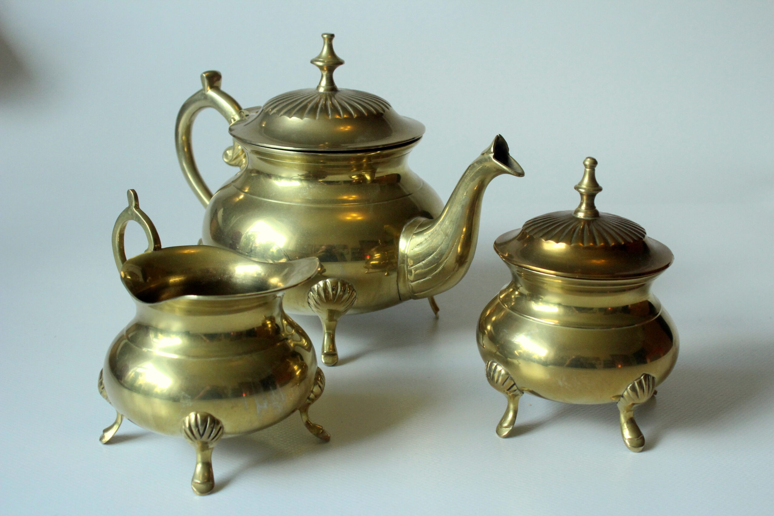 Metal teapot gold plated, inside silver plated, with milk pot and sugar bowl as a set, vintage from the 70s