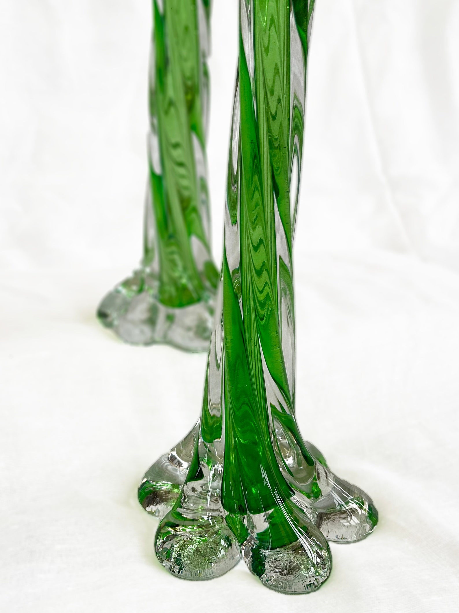 A pair of Uranium green French vintage twist stem vases. Art glass flower sleeves, circa 1950.